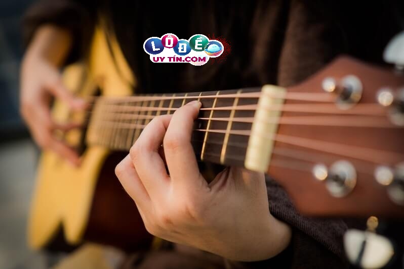Giải mã giấc mơ guitar - Mơ thấy đàn guitar đánh con gì?
